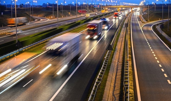 highway infrastructure with many vehicles moving in a ver fast pace