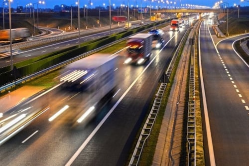 highway infrastructure with many vehicles moving in a ver fast pace