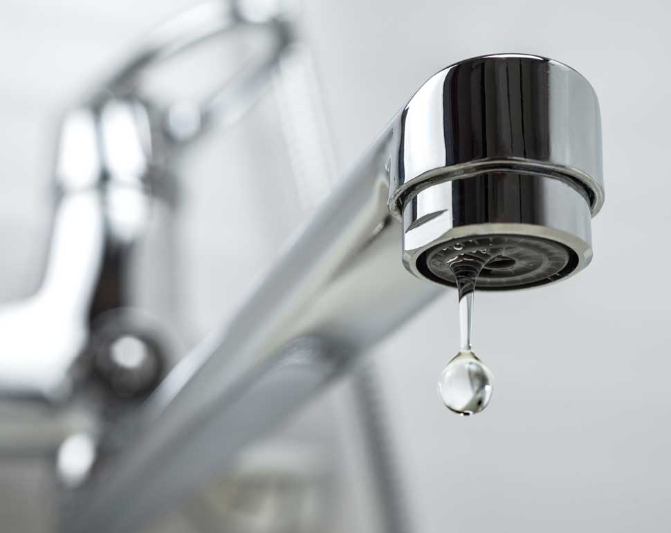 single drop of water falling from a tap