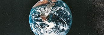 View of Earth from space with North and South America visible, surrounded by the blackness of outer space, representing global beauty and environmental awareness