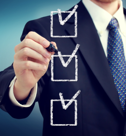Man in a suit marking checkboxes on a transparent screen