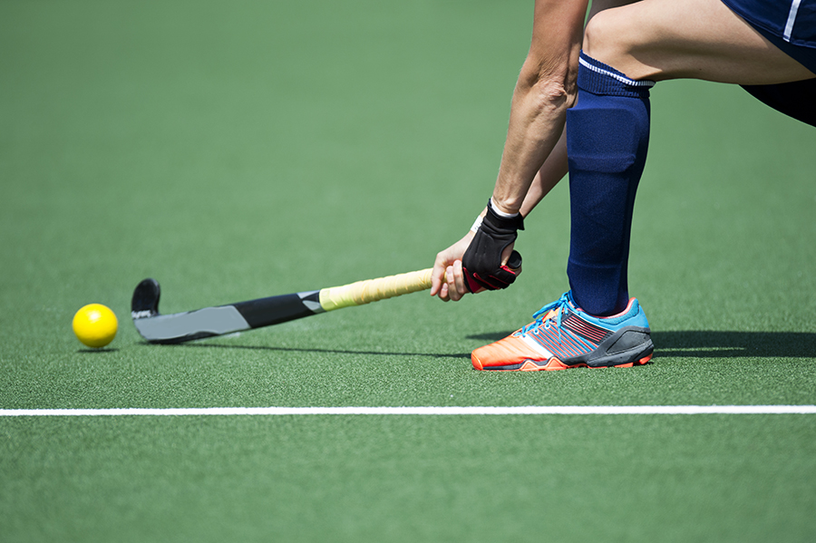 Hockeyer op hockeyveld